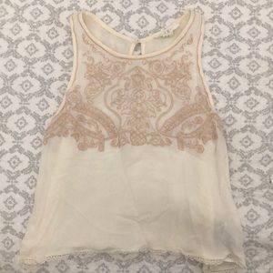 Off-white crop shirt with a rose gold design.